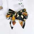 Close-up of narrow satin scarf featuring tarot card prints and a white care label - Heart Label Green