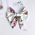 Floral print bow hair tie with long ribbons on a minimalist white fashion magazine background - Floral White Base