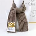 Deep khaki chunky knit scarf featuring Good Luck text patch and classic ribbed texture - Camel