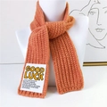 Chunky knit scarf in vibrant orange featuring a white Good Luck message patch - Bright Orange