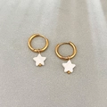 Gold geometric hoop earrings with white shell star pendants on gray textured background - Five-pointed Star