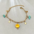 Gold chain bracelet with stars, turquoise stones, and a yellow shell shell pendant - Yellow