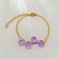 Gold stainless steel bracelet with four purple faceted crystal beads and lobster clasp - Purple