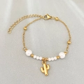 Gold beaded chain bracelet with white pearls and a minimalist cactus charm pendant - Cactus Style