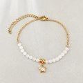 Gold stainless steel beaded bracelet with white opal and a sparkling star pendant - White