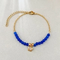 Bracciale minimalista con perline occhio di gatto e ciondolo stella oro in blu - Blu