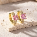 Detail of 18K gold earrings with pink princess cut zircon on beige stone stand - Pink Princess Cut Pave