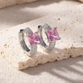 Macro shot of silver hoop earrings with a princess cut pink crystal and micro pavé stones - Pink Diamond Pave Huggie