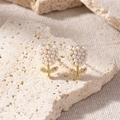 Detail of tulip earrings with gold frame, white pearls and sparkling leaf rhinestones - Tulip Pearl Zirconia