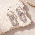 Close-up of geometric silver earrings with rectangular studs and crystal-studded oval drops - Oval Full Pave Pendant