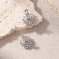 Detailed macro view of heart shaped silver earrings with shimmering baguette cut zircons - Silver Heart Pave