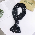 Narrow black silk scarf with white heart pattern tied as a fashion accessory - Black with White Hearts