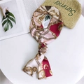 Narrow pink silk twilly scarf with elegant gold chain and key patterns on a white table - 14 Pink Keychain