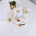White satin silk scarf with fresh peach prints and letters in a stylish fold - Peach