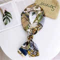 Narrow silk scarf with blue and yellow chain print tied on a minimalist white surface - 20 Viewport Yellow Green