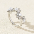Detailed close-up of adjustable silver wave ring with five white pearls and zircons - Silver Wave Multiple Pearl Zirconia Style (Style D)