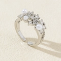 Macro shot of silver adjustable pearl ring with pavé-set cubic zirconia details - Silver Starry Pearl Zirconia Style (Style H)