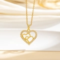Detailed close-up of golden heart pendant with pavé cubic zirconia on soft silk background - Intertwined Double Hearts (C)
