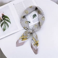 Elegant equestrian style silk scarf with gold chain patterns in beige and black - Metallic Pink Grey