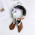 Floral print silk scarf in coffee and emerald green tied in a decorative loop - 4 Rabbit Elf Brown Border