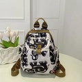 Fashionable Oxford backpack featuring black and white abstract elephant print and brown straps - Elephant