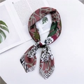 Silk neck scarf with green leaf and leopard print on a magazine layout background - Spotted Pink