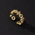 Detail of adjustable gold ring featuring hollow clover patterns and sparkling zircons - Gold Clover Open Zirconia Ring (H)