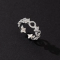 Close-up of silver star ring with shimmering zircons on a dark textured background - Silver Pentagram Zirconia Open Ring (D)