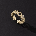 Adjustable gold star ring with micro-p鑲嵌ed zircons shown at a 45-degree angle - Gold Hollow Star Zirconia Ring (C)