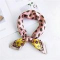 Pink and yellow silk scarf featuring paisley and geometric patterns in a knotted loop - 18 Paisley Pink Yellow