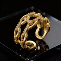 Elegant gold double-layered chain ring with sparkling crystals on a sleek black surface - Double Layer Cross Chain (A) / Gold