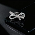 Macro detail of silver bow ring with white pearls and sparkling zircons on black surface - Asymmetric Bowknot Pearl Style / Silver Asymmetric Bowknot Pearl Style (D)