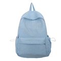Minimalistische lichtblauwe rugzak met bubbeltextuur en functionele zijzakken - Blauw