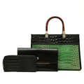 Detail view of 3-piece crocodile pattern bag set with resin handles and matching wallets - Green Stone Texture
