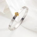 Bracciale quadrifoglio in acciaio inossidabile lucido con ciondolo d'oro e diamanti - Bicolore (Oro e Argento)