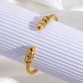 Twisted cable open cuff bracelet in gold finish with crystal-embellished bullet ends - Pointed End Cable Style / Gold (szgss130)