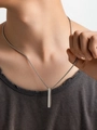 Close-up of minimalist silver stainless steel rectangular bar pendant on box chain necklace - 18K Gold / Steel