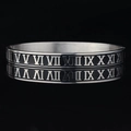 Silver stainless steel bangle featuring embossed Roman numerals with black enamel inlay - Steel