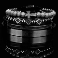 Macro detail of 4-piece vintage steel bracelets with zircon stones and Spanish engraving - Black
