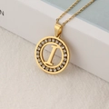 Gold stainless steel necklace featuring a round pavé diamond pendant with the letter I - Letter I