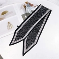 Detail of narrow black and white leaf print silk scarf with pointed ends on a magazine - 86cm / Floral Black Gray