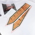 Detail of orange dog print silk scarf with green borders and sharp corner design - 86cm / Dalmatian Orange Pink