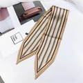 Detailed close-up of a striped silk scarf with pointed ends displayed on an aesthetic table - 86cm / Colorful Stripes Khaki