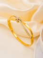 Detail of rose gold bow bracelet with sparkling pavé crystals and interlocking metal bands - Gold