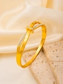 Detailed view of gold bangle with Roman numeral engraving and sparkling pave zircons - 18K Gold / Gold