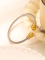 Detail of silver twisted cable bracelet with gold hammered spheres and zircon accents - Silver Cable with Gold Hammered Ball