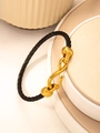 Dettaglio del bracciale in corda d'acciaio nera con chiusura a gancio a S dorata - Oro Nero