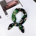 Elegant emerald green and gold chain print silk scarf on a stylish fashion magazine - Green Double Ring