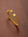 Macro shot of gold braided twisted bangle showing high-quality metal mesh texture - 18K Gold / Gold