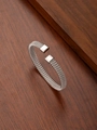 Detail of 8mm silver stainless steel woven mesh open bangle with smooth square end caps - 18K Gold / Steel